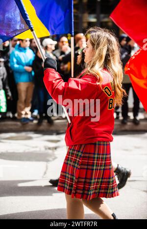 Montreal, Canada - March 17 2024： People celebrating the Saint Patrick`s Day Parade in Montreal downtown Stock Photo